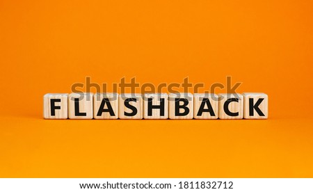 Wooden cubes with word 'flashback'. Beautiful orange background. Business and educational concept. Copy space.