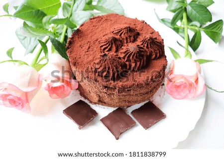 chocolate truffle cake isolated on white background and rose