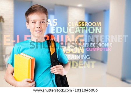 Young american boy teen student hold book