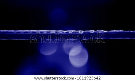 Boxing ring ropes with a blur spotlight. Blue color filter