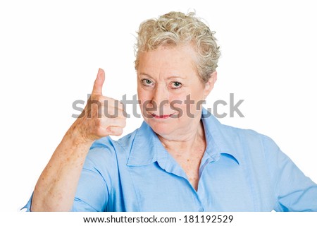 Closeup portrait of senior mature happy, smiling, excited natural woman giving thumbs up sign with fingers, isolated on white background. Positive emotion facial expressions symbols, feelings attitude
