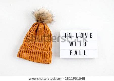 Autumn flat lay composition with lightbox with the phrase In Love with Fall. Autumn, fall, comfort, slow living concept. Top view