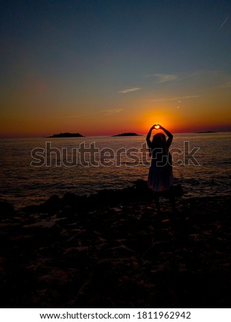 Lady on the best Sunset heart hands