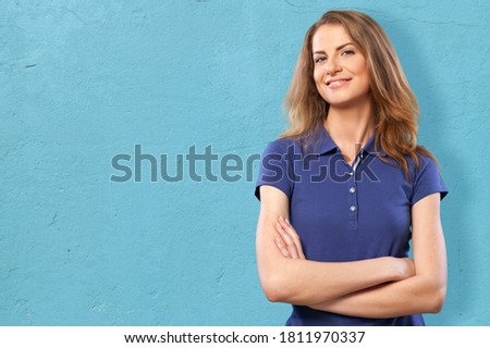 Portrait of pretty teen girl posing on the colored background.