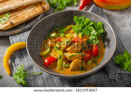 Spicy indian meal with meat, vegetable and bread