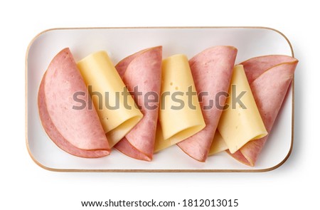 breakfast plate of cheese and ham sausage isolated on white background, top view Royalty-Free Stock Photo #1812013015