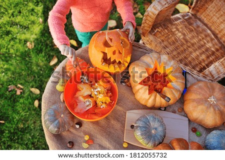 Top view picture of carved pumpking on the table