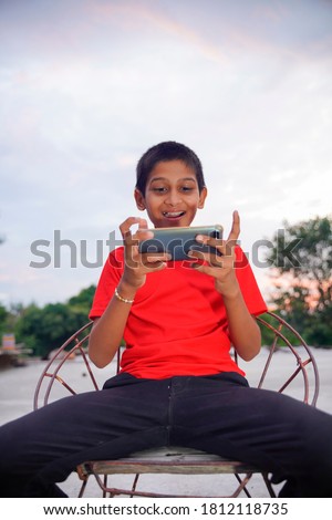 Indian Cute Little Boy With Cellphone
