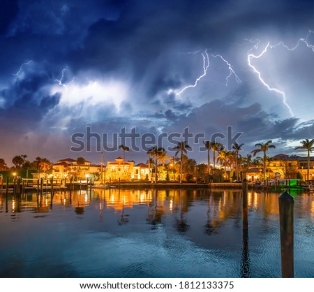 Boca Raton buildings along Lake Boca Raton during a storm, Florida. Royalty-Free Stock Photo #1812133375