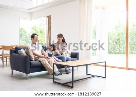 Family talking in the living room Royalty-Free Stock Photo #1812139027