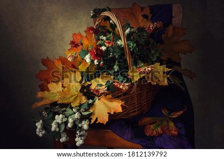 Still life with autumnal composition on the chair