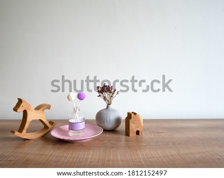 Small wooden decorations on office desk, white backgroud, natural light, copy space