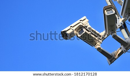 security camera on a metal pole looking out for crime no people stock photo 