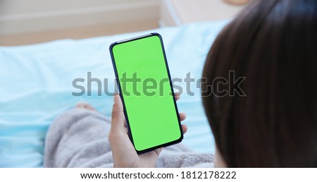 telemedicine concept - asian female patient use green screen mobile phone to consult her health condition to doctor