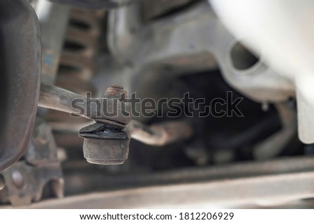Close-up of damaged links control arm boot ,car suspension. Royalty-Free Stock Photo #1812206929