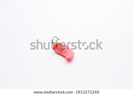 Hot and appetizing peppers on a white background.

