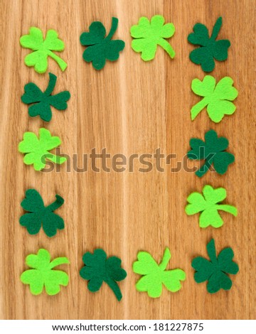 Clover leaves on wooden background