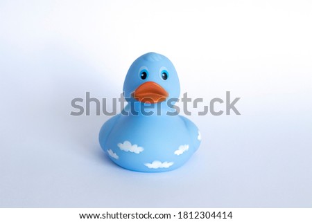 blue duckling children's toy on a white background