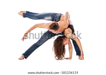Couple of ballet dancers posing isolated over white background