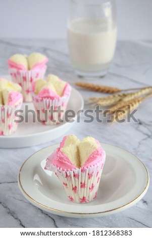 steamed sponge cake in pink and white colour. selective focus