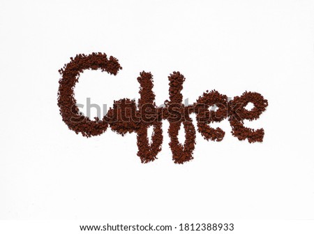 Coffee powder make the words 'Coffee' on white background