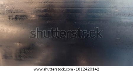 view from above on texture of wet old asphalt road Royalty-Free Stock Photo #1812420142