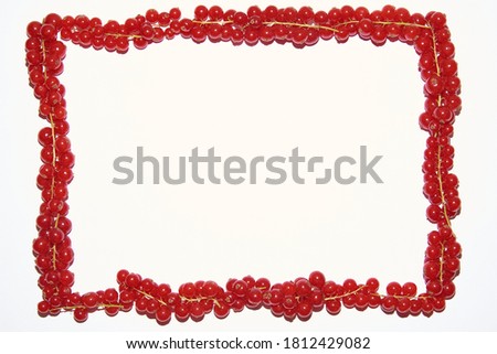 square frame made of red currant on a white background