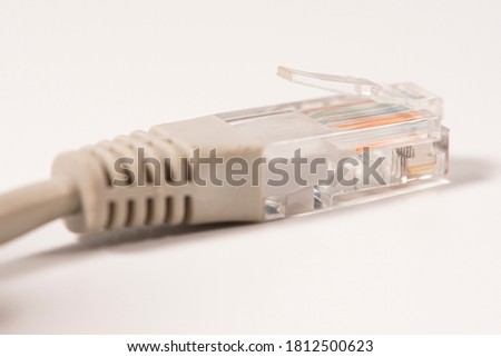 Gray Network Cable with molded RJ45 plug isolated against white background.