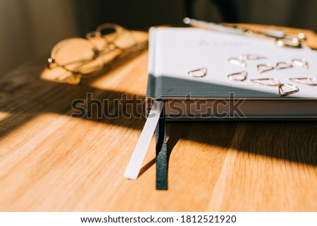book mark ribbon of a journal on a table at home