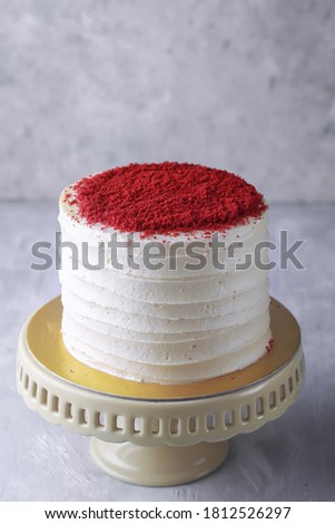 Moist Red velvet cake with creamchesse frosting on cake stand