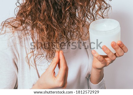 Female's hands apply cosmetic coconut oil