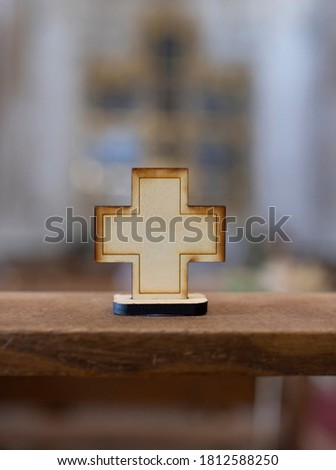 wooden cross on a church blur background