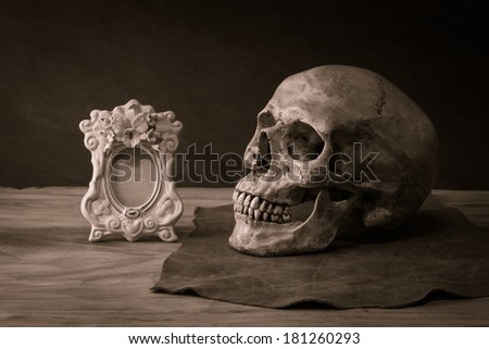 Still life with human skull classic picture frame