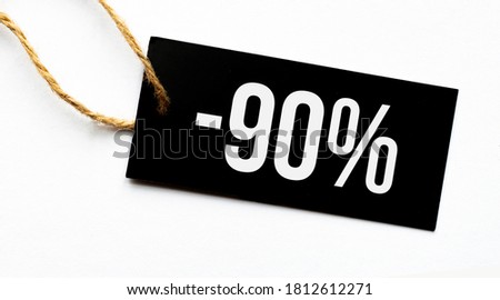 SALE 90 percents text on a black tag on a white paper background