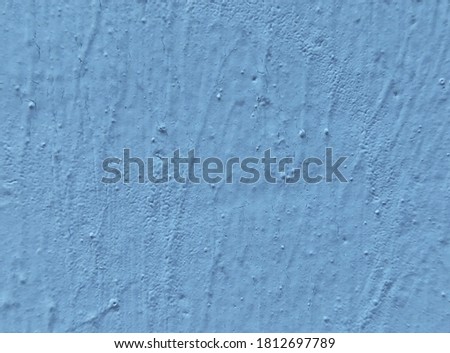 Rough cement background painted light blue