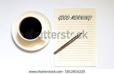 GOOD MORNING - white paper with pen and coffee on the white background