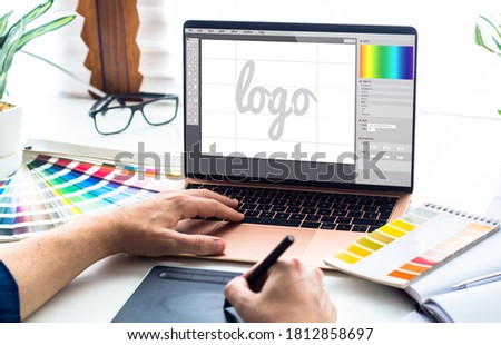 Graphic design desktop with  laptop and tools 