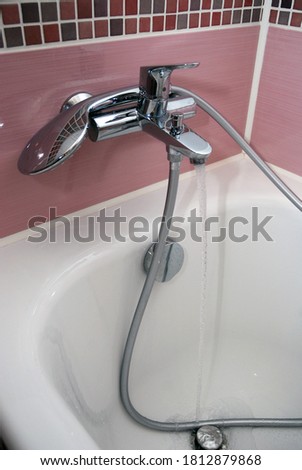 water flows from the bathroom faucet