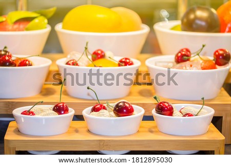 colorful imitate various types of fruit in white cup on shelf for advertising or marketing