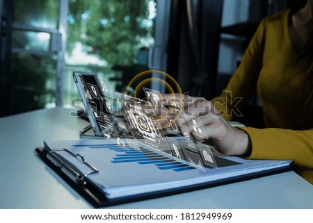 Double exposure of businesswoman hands working on tablet computer with digital marketing virtual chart, Abstract icon, Business strategy concept, Background toned image blurred.