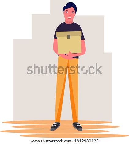 A man stands and holds a box parcel. Courier with a box