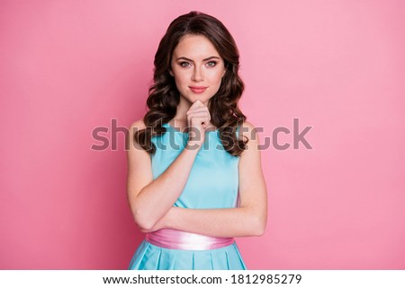 Photo of pretty attractive charming wavy lady good mood hold arm on chin intelligent person listen friendly conversation nice talk wear blue dress isolated pink color background