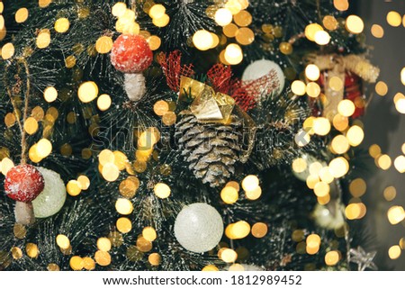 Decorated Christmas or New Year tree with many lights festive background.