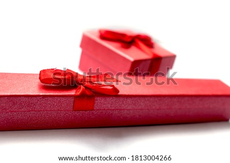 Two red boxes for decorations with red ribbons for any occasion isolated items on a white background
