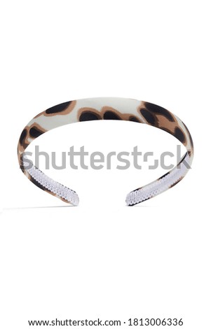 Subject shot of white silk headband with brown and black leopard print. The hair holder is isolated on the white background.