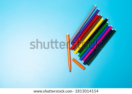 Colourful marker pen isolated on blue