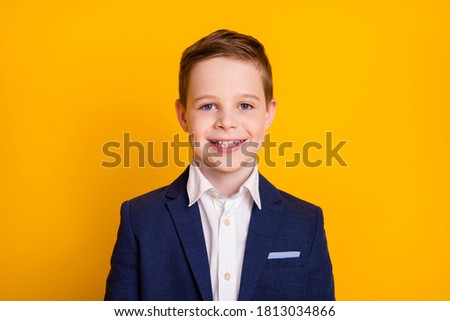 Close-up portrait of his he attractive cheerful cheery pre-teen boy new semester quarter season isolated over bright vivid shine vibrant yellow color background