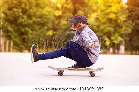 Young sporty girl riding on longboard in park. Lifestyle concept