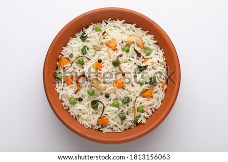 indian veg biryani, veg pulav, Indian vegetable pulav, Biriyani, vegetable Biriyani served in a terracotta bowl  Royalty-Free Stock Photo #1813156063