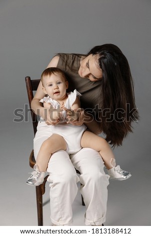 bright picture of hugging mother and daughter, indoors, isolated. Happy motherhood